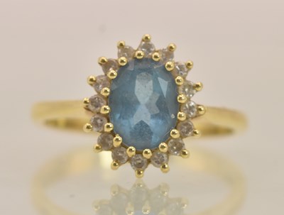 Lot 1287 - An 18ct yellow gold dress ring, with central...