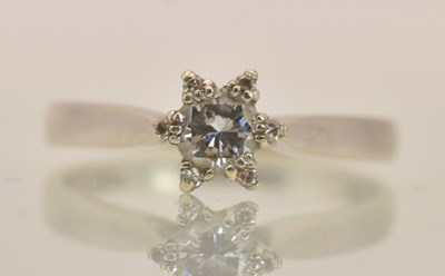 Lot 1236 - An 18ct white gold diamond floral cluster ring,...