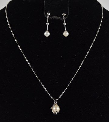 Lot 1313 - An 18ct white gold beaded necklace with...