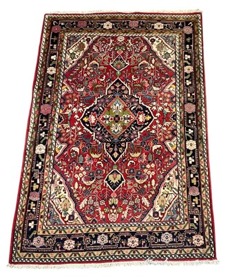 Lot 133 - A modern hand woven woollen red ground Persian...