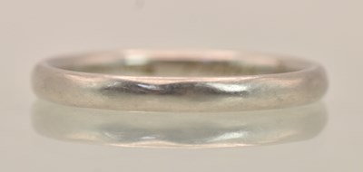 Lot 1266 - A platinum thin band ring, size M, approx 3.02g.