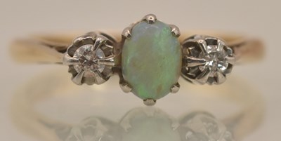 Lot 1317 - An 18ct yellow gold and platinum tipped opal...