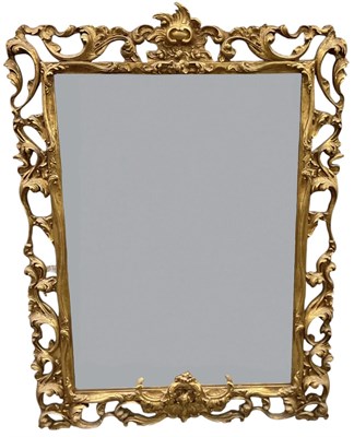 Lot 97 - An early 20th century ornately gilt framed...
