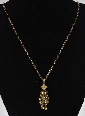 Lot 1312 - A 9ct yellow gold articulated clown pendant...
