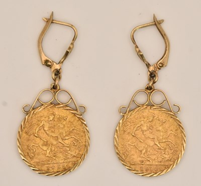 Lot 1359 - A pair of half sovereign set drop earrings in...