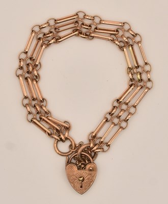 Lot 1416 - A 9ct rose gold three bar gate link bracelet,...