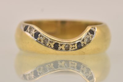 Lot 1208 - An 18ct yellow gold band ring, with diamond...