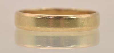 Lot 1284 - A 9ct yellow gold band ring, size O, approx...