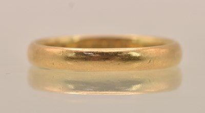 Lot 1237 - A 22ct yellow gold thin band ring, size O,...