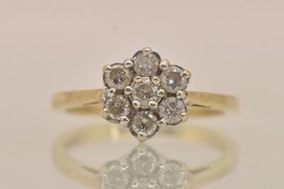 Lot 1247 - An 18ct yellow gold diamond floral cluster set...