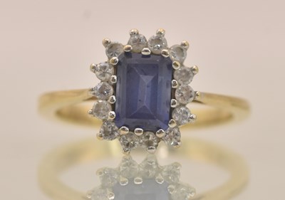 Lot 1334 - A 9ct yellow gold dress ring, with sapphire...