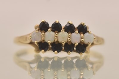 Lot 1282 - A 9ct yellow gold sapphire and opal cluster...
