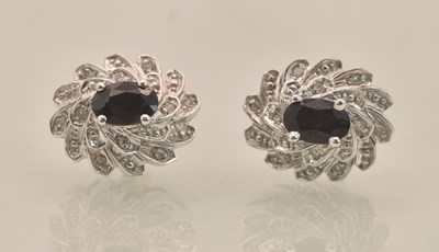 Lot 1373 - A pair of 9ct white gold sapphire and tiny...