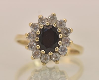 Lot 1280 - A 9ct yellow gold sapphire and cubic zirconia...