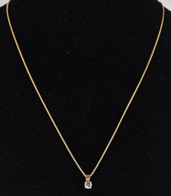 Lot 1321 - An 18ct yellow gold dainty necklace with hoop...