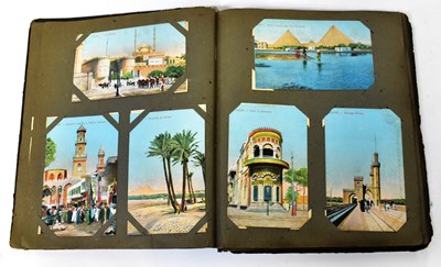 Lot 586 - An Edwardian postcard album containing...