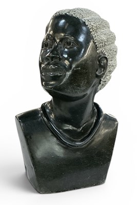 Lot 668 - An African carved black granite portrait bust...