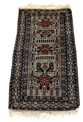 Lot 122 - A hand woven woollen ground blue Baluchi rug,...