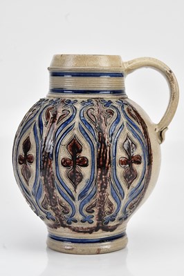 Lot 1328 - WESTERWALD; a large salt glazed jug, with...