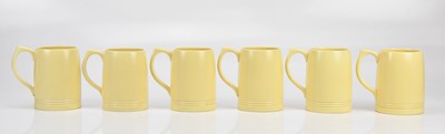 Lot 1315 - KEITH MURRAY FOR WEDGWOOD; a set of six yellow...