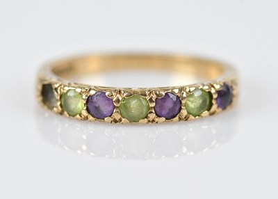 Lot 590 - A 9ct yellow gold six stone dress ring, set...