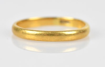 Lot 434 - A 22ct yellow gold wedding band, size P,...