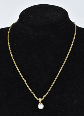 Lot 241 - A diamond and pearl pendant stamped '750',...