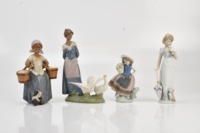 Lot 1262 - LLADRÓ; a group of four figures comprising...