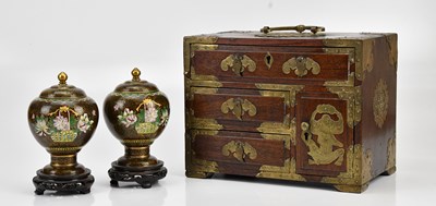 Lot 1167 - A pair of cloisonné lidded vases, on wooden...