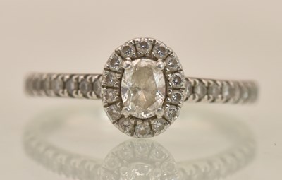 Lot 1289 - A platinum (PT950) diamond cluster ring, the...