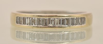 Lot 1226 - An 18ct white gold half eternity ring, with...
