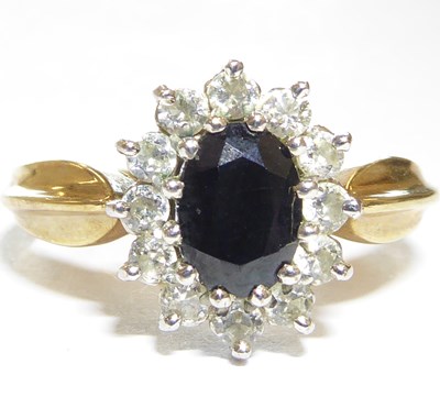 Lot 961 - A 9ct gold ring with claw set sapphire in...