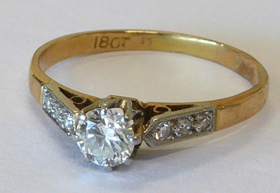 Lot 936 - An 18ct gold diamond solitaire ring, claw set...