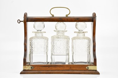 Lot 468 - A 1920s oak tantalus with silver plated mounts,...