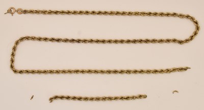 Lot 1330 - A 9ct yellow gold double twist necklace in two...