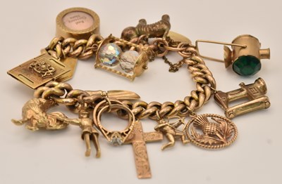 Lot 1397 - A 9ct yellow gold charm bracelet, with...