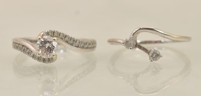 Lot 1232 - A set of two 14K white gold interlocking rings,...
