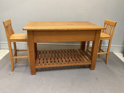 Lot 1031 - A modern oak two tier kitchen island with two...