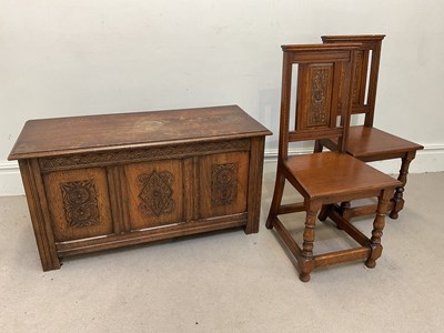 Lot 1117 - A reproduction carved oak coffer, height 56cm,...