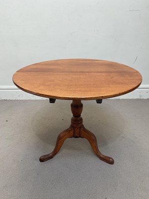 Lot 1313 - A 19th century circular tilt-top tripod table,...