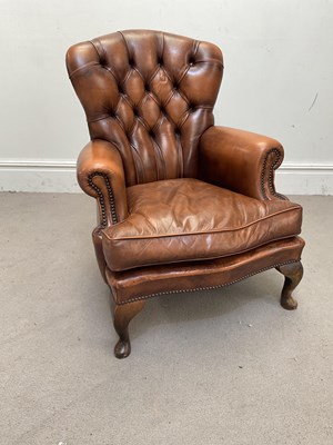 Lot 1116 - A Chesterfield type buttoned brown leather...