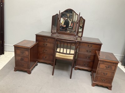 Lot 1139 - A reproduction mahogany nine drawer dressing...