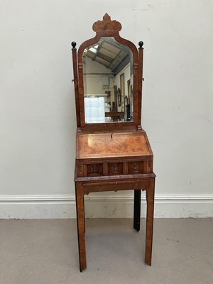 Lot 1089 - A good reproduction yew or burr elm bureau of...