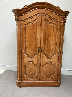 Lot 51 - A late 19th century carved pitch pine armoire...