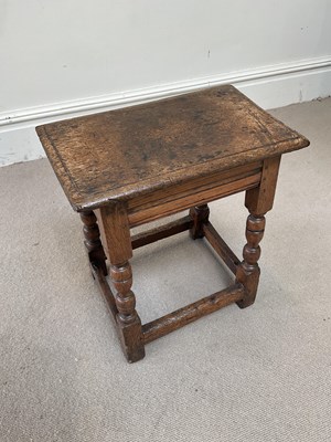 Lot 57 - An 18th century oak joint stool, on turned...