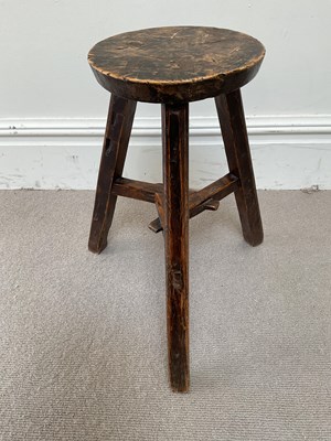 Lot 58 - An 18th century country elm milking stool,...