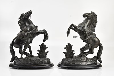 Lot 587 - A pair of spelter Marly horses, on ebonised...