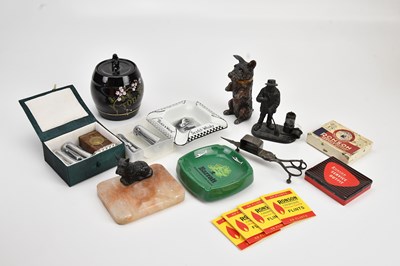 Lot 557 - A collection of smoking related items to...