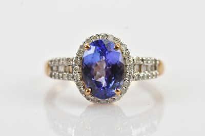Lot 457 - A 9ct yellow gold diamond and tanzanite...