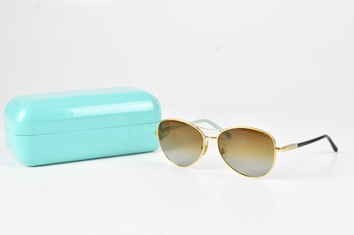 Lot 1298 - TIFFANY & CO; a pair of gold tone rimmed...